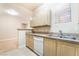 Bright kitchen featuring a double sink, dishwasher, and neutral color scheme at 8000 Badura Ave # 1058, Las Vegas, NV 89113