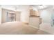 Bright living room featuring a sliding door and adjacent kitchen area at 8000 Badura Ave # 1058, Las Vegas, NV 89113