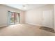 Spacious living room with balcony access and natural light at 8000 Badura Ave # 1058, Las Vegas, NV 89113