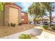 Exterior view showing the building facade, parking area, and neat landscaping at 8000 Badura Ave # 1058, Las Vegas, NV 89113