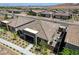 Aerial view of a desert community with mountain views, showcasing a patio area at 897 Woodburn Ln, Las Vegas, NV 89138
