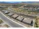 Expansive aerial view showcasing the community layout with desert landscaping and mountain views at 897 Woodburn Ln, Las Vegas, NV 89138