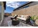 A tranquil patio with comfortable seating and a view of the brick surround at 897 Woodburn Ln, Las Vegas, NV 89138