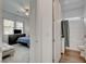 View of a bedroom leading to a bathroom with a shower/tub combination at 897 Woodburn Ln, Las Vegas, NV 89138