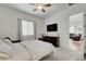 Cozy bedroom with soft carpet, neutral walls, and a ceiling fan at 897 Woodburn Ln, Las Vegas, NV 89138