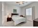 Bright bedroom with soft carpet, a ceiling fan, and a window with blinds at 897 Woodburn Ln, Las Vegas, NV 89138