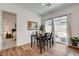 Bright dining area with patio access, complemented by a view of the bedroom suite at 897 Woodburn Ln, Las Vegas, NV 89138