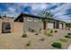 Single-story home featuring neutral color palette, desert landscaping, and block wall at 897 Woodburn Ln, Las Vegas, NV 89138