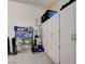 An organized garage with storage cabinets, shelving, and speckled epoxy flooring at 897 Woodburn Ln, Las Vegas, NV 89138