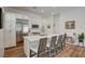 Bright, open kitchen with white cabinetry, a large island, and stainless steel appliances at 897 Woodburn Ln, Las Vegas, NV 89138