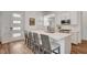 Contemporary kitchen features a large island with seating and modern stainless steel appliances at 897 Woodburn Ln, Las Vegas, NV 89138