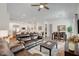 Open floor plan showcasing living room, dining area, and kitchen with stainless steel appliances at 897 Woodburn Ln, Las Vegas, NV 89138