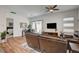 Bright living room with wood floors, comfortable seating, and views to the backyard at 897 Woodburn Ln, Las Vegas, NV 89138