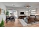 Cozy living room featuring a dining area, comfortable seating, and natural light at 897 Woodburn Ln, Las Vegas, NV 89138