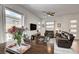 Open floor plan shows living room, dining, and access to outdoor patio at 897 Woodburn Ln, Las Vegas, NV 89138