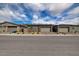 Street view of modern homes featuring desert landscaping and neutral color schemes at 897 Woodburn Ln, Las Vegas, NV 89138