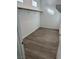 A walk-in closet with hardwood flooring and an installed clothes rod ready for storage at 897 Woodburn Ln, Las Vegas, NV 89138