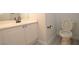 Bathroom with white cabinets, white sink, and dark hardware at 9343 Leaping Deer Pl # 103, Las Vegas, NV 89178