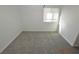 Bedroom with neutral carpeting and window at 9343 Leaping Deer Pl # 103, Las Vegas, NV 89178