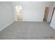 Large bright bedroom featuring modern carpeting and neutral paint with ensuite bathroom at 9343 Leaping Deer Pl # 103, Las Vegas, NV 89178