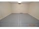 This garage features painted floors and a back entrance door at 9343 Leaping Deer Pl # 103, Las Vegas, NV 89178