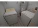 A laundry room featuring a washer and dryer with neutral colored floors at 9343 Leaping Deer Pl # 103, Las Vegas, NV 89178