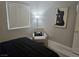 Bedroom featuring a simple chair and side table with a modern design print on the wall at 950 Seven Hills Dr # 2313, Henderson, NV 89052