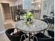 Modern dining area adjacent to the kitchen featuring stainless steel appliances and a stylish table setting at 950 Seven Hills Dr # 2313, Henderson, NV 89052
