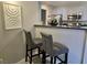 Convenient kitchen area with bar seating, perfect for casual dining and entertaining guests at 950 Seven Hills Dr # 2313, Henderson, NV 89052