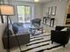 Inviting living room with access to an outdoor balcony, complemented by chic decor and furnishings at 950 Seven Hills Dr # 2313, Henderson, NV 89052