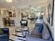 Cozy living room featuring modern furniture, an open floor plan, and bright natural light at 950 Seven Hills Dr # 2313, Henderson, NV 89052