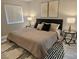 Spacious main bedroom featuring a plush bed, elegant lamps, and modern bedside tables at 950 Seven Hills Dr # 2313, Henderson, NV 89052