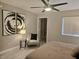 Bright main bedroom with modern artwork, a cozy reading chair, and a serene atmosphere at 950 Seven Hills Dr # 2313, Henderson, NV 89052