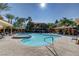 Beautiful community pool area with palm trees, sunshades, and comfortable lounge chairs at 950 Seven Hills Dr # 2313, Henderson, NV 89052