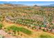 Scenic aerial view of a golf community set against a backdrop of mountains, offering stunning vistas at 9540 Eagle Valley Dr, Las Vegas, NV 89134