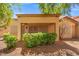Charming home featuring a covered porch and mature landscaping, providing a shaded and inviting outdoor space at 9540 Eagle Valley Dr, Las Vegas, NV 89134