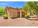 Attractive single-story home with well-maintained landscaping and a cozy front porch area, perfect for relaxation at 9540 Eagle Valley Dr, Las Vegas, NV 89134