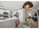 Bright kitchen features stainless steel appliances, white cabinets and a view of the living room at 9540 Eagle Valley Dr, Las Vegas, NV 89134