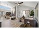 Bright living room featuring a modern fireplace, high ceilings, and an open concept design with neutral tones at 9540 Eagle Valley Dr, Las Vegas, NV 89134