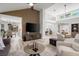 Inviting living room showcasing open floor plan, high ceilings, modern decor, and seamless flow to the dining area at 9540 Eagle Valley Dr, Las Vegas, NV 89134