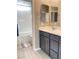 Bathroom features a sleek vanity with dual sinks and a shower/tub combination at 10152 Tenaya Meadows St, Las Vegas, NV 89178