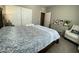 Well-lit bedroom features a comfortable bed, dresser, and cozy armchair for relaxation at 10152 Tenaya Meadows St, Las Vegas, NV 89178