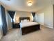 The main bedroom is bathed in soft light and has ample space and plush carpeting at 10152 Tenaya Meadows St, Las Vegas, NV 89178