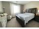 Bright bedroom with a large bed, dresser, and window that lets in plenty of natural light at 10152 Tenaya Meadows St, Las Vegas, NV 89178