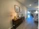 Inviting entryway with decorative console table and wood-look flooring at 10152 Tenaya Meadows St, Las Vegas, NV 89178