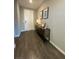 Inviting entryway with decorative console table and wood-look flooring at 10152 Tenaya Meadows St, Las Vegas, NV 89178