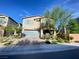 Charming two-story home features a two-car garage, tidy landscaping, and inviting front porch at 10152 Tenaya Meadows St, Las Vegas, NV 89178