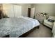Carpeted main bedroom with white accents, a dark wood bed, and natural light at 10152 Tenaya Meadows St, Las Vegas, NV 89178