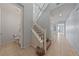 Hallway with staircase leading to upstairs and a powder room off the hallway at 10373 Northern Hills Ave, Las Vegas, NV 89166