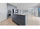 Open concept kitchen with granite island, double oven, stainless appliances, and seamless flow into living area at 10373 Northern Hills Ave, Las Vegas, NV 89166